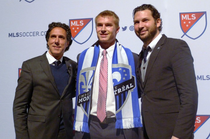 Clemson defender Kyle Fisher went 14th to the Montreal Impact in the MLS SuperDraft in Baltimore on Thursday, Jan. 14, 2016. coach Mauro Biello is at left and technical director Adam Braz is at right.