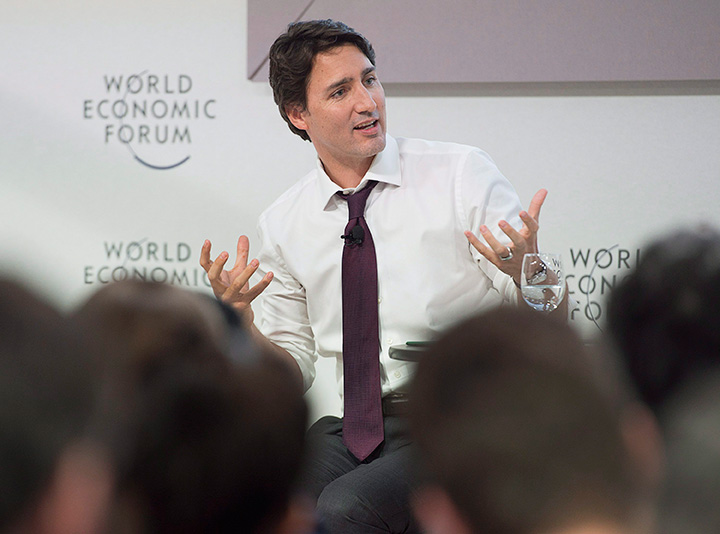 Prime Minister Justin Trudeau speaks at a session called Global Shapers on Pluralism, in Davos, Switzerland on Thursday, Jan. 21, 2016. Trudeau is attending the World Economic Forum where political, business and social leaders gather to discuss world agendas. 
