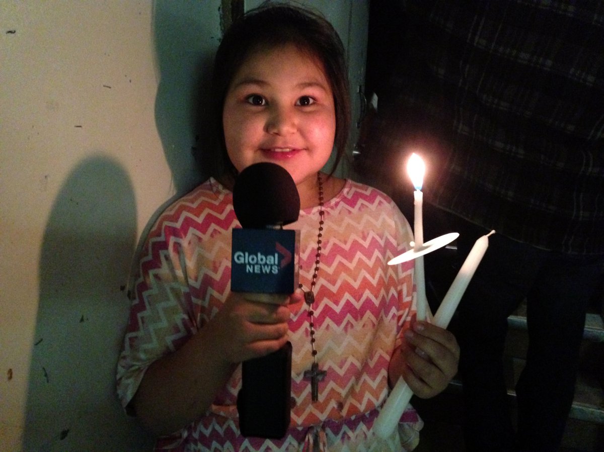 Kiandra Janvier's mother allowed Global crews to take her photo at a candle light vigil in La Loche.