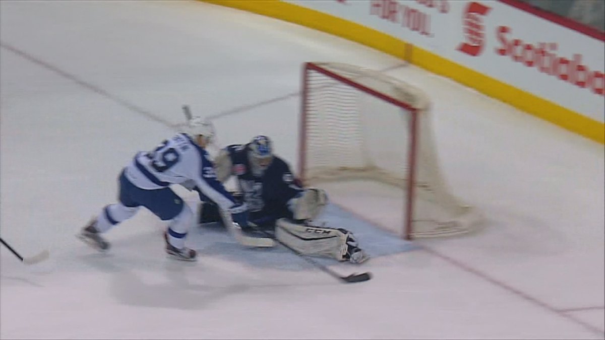 Manitoba Moose goaltenders Eric Comrie keeps Matt Frattin from scoring in a 3-0 loss to the Toronto Marlies.