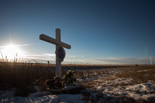 A memorial to a previous crash marks the intersection at Wanuskewin Rd and Highway 11, outside of Saskatoon. The intersection was the scene of tragedy where a family of four were killed in a collision with an SUV Sunday morning.