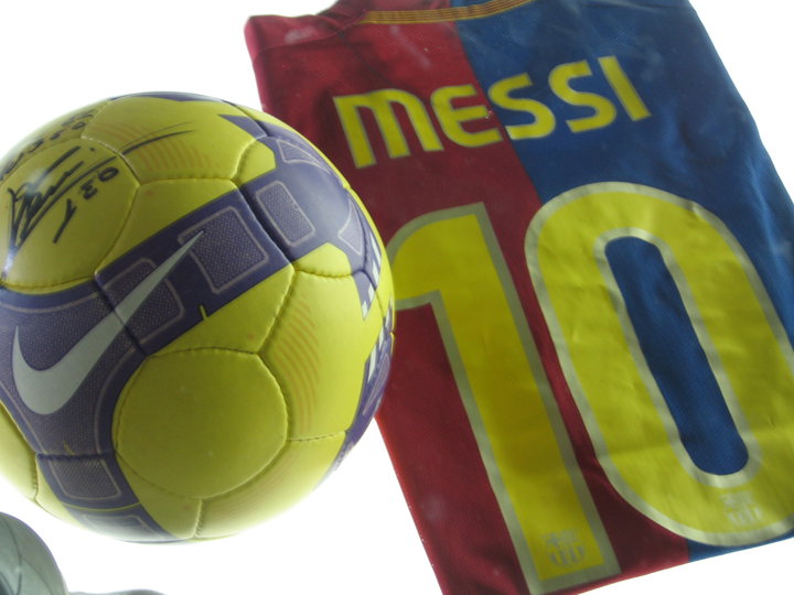 Lionel Messi Jersey and signed Ball inside the Camp Nou museum & stadium.