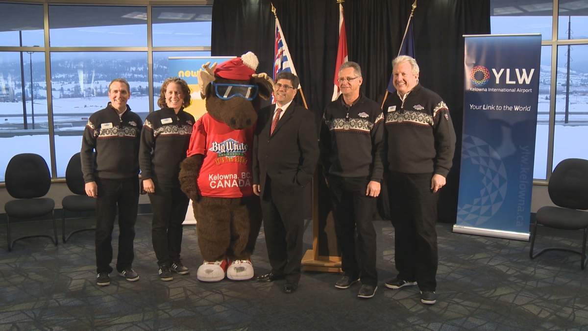 Newleaf Travel CEO Jim Young (center) poses with staff from the Big White Ski Resort near Kelowna during the launch of their direct flights between Kelowna and other Canadian cities. 