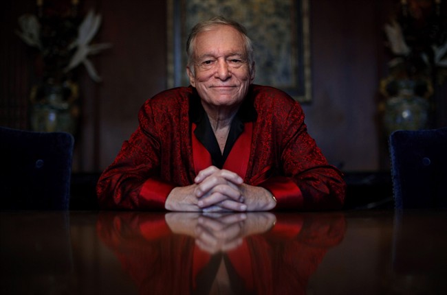  In this Nov. 4, 2010, file photo, Playboy magazine founder Hugh Hefner poses for photos at the Playboy Mansion in Los Angeles.