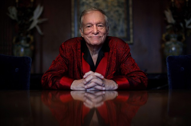  In this Nov. 4, 2010, file photo, Playboy magazine founder Hugh Hefner poses for photos at the Playboy Mansion in Los Angeles.