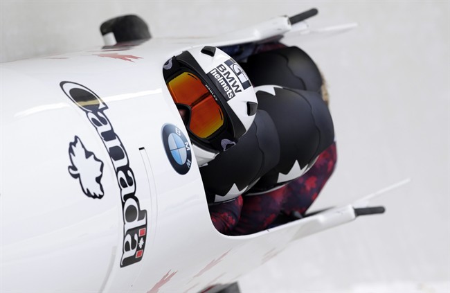 Driver Kaillie Humphries with Cynthia Appiah, Genevieve Thibault and brakeman Melissa Lotholz, of Canada, compete in the four-person bobsled World Cup race on Saturday, Jan. 9, 2016, in Lake Placid, N.Y.