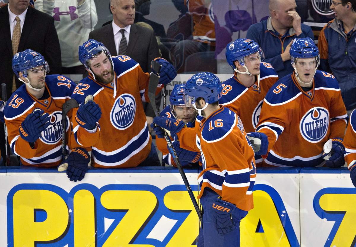Edmonton Oilers' Teddy Purcell (16) celebrates his shootout goal against the Calgary Flames during third period NHL action in Edmonton, Alta., on Saturday January 16, 2016. THE CANADIAN PRESS/Jason Franson.