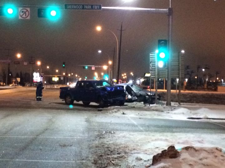 Police investigate a serious crash between a car and a pickup truck at 50 Street and Sherwood Park Freeway on Jan. 8, 2016.