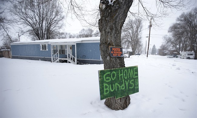 A sign referencing Ammon Bundy and his brother, who are the sons of Nevada rancher Cliven Bundy, hangs on a tree in front of a home Tuesday, Jan. 5, 2016, in Burns, Ore. 
