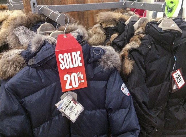 Winter jackets on sale are seen in a Montreal store. 