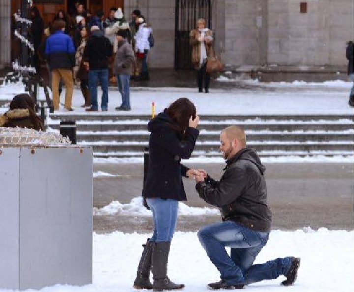 Rodney Comer got down on one knee to propose to girlfriend, Heidi Moore, on New Year's Day in Montreal. Friday, Jan. 1, 2016.