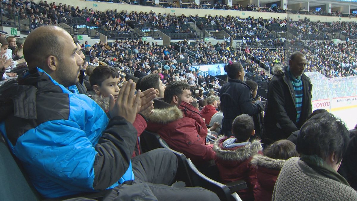 Refugees were welcomed to the Manitoba Moose game on Friday night. 