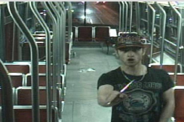 Sammy Yatim holds a knife while on a streetcar in Toronto on July 26, 2013 in this still taken from court handout surveillance video. A Toronto jury that will decide the fate of a police officer accused in the shooting death of 18-year-old Sammy Yatim watched several videos of the incident Wednesday showing the teen crumple to the floor of an empty streetcar.