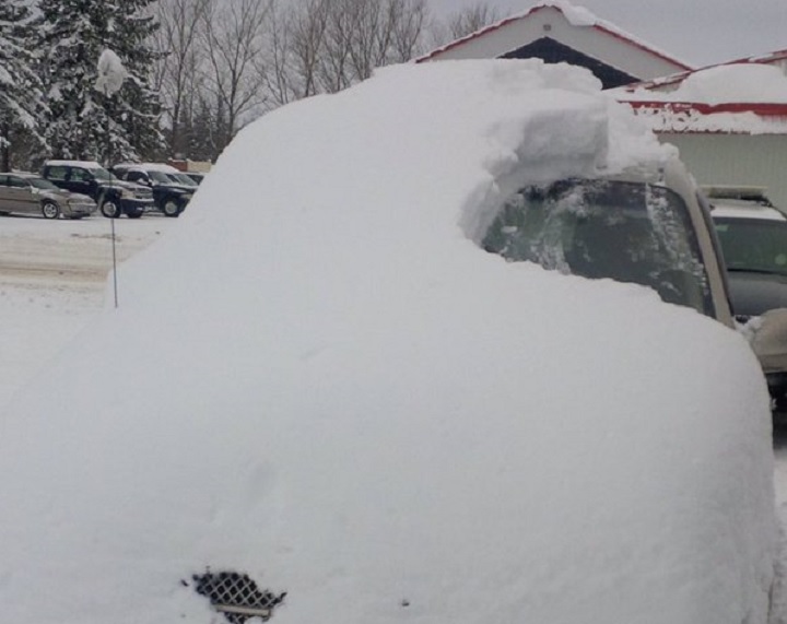 OPP tweeted a photo of a snow covered car in Huron County on Jan. 19, 2016.
