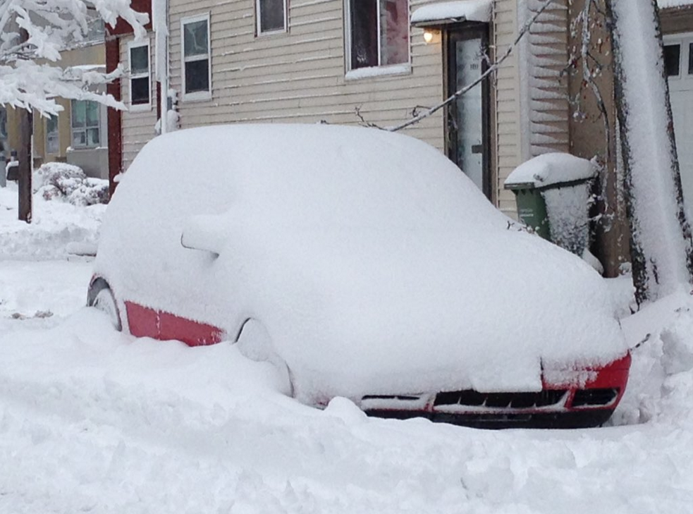 A car is buried in snow on a Halifax street after the first snow storm of 2016 on January 13.