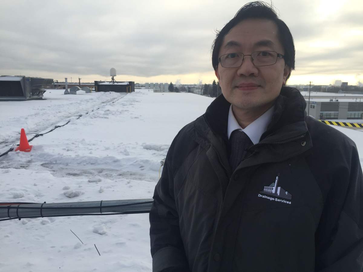 Steven Chan, a senior hydrologic engineer with the City of Edmonton’s drainage services department stands on the rooftop of Campbell Scientific Corp. in north west Edmonton.