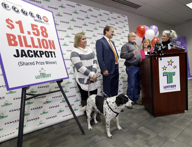 Rebecca Hargrove, right, president and CEO of the Tennessee Lottery, announces that the winning Powerball ticket of the John and Lisa Robinson family is authentic Friday, Jan. 15, 2016, in Nashville, Tenn. 