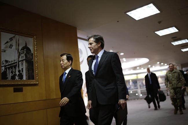 U.S. Deputy Secretary of State Antony Blinken, right, walks with South Korean Defense Minister Han Min-Koo upon his arrival for their meeting at the Defense Ministry in Seoul, South Korea Wednesday.