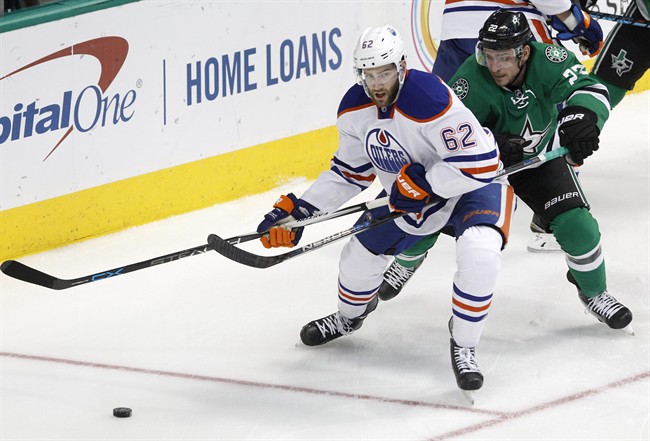 Edmonton Oilers defenseman Eric Gryba (62) is pressured by Dallas Stars center Colton Sceviour (22) during the first period of an NHL hockey game Thursday, Jan. 21, 2016, in Dallas. 