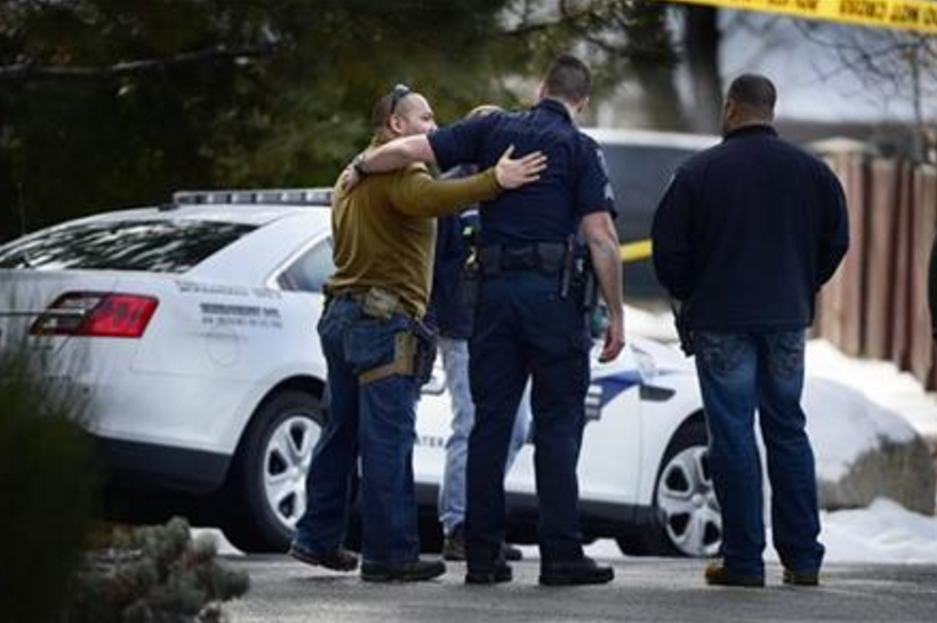 Police talk at the scene of an officer-involved shooting, in Holladay, Utah, Sunday, Jan. 17, 2016. Utah police officer Douglas Barney was killed Sunday, after he was shot by a suspect who was later killed by police. 