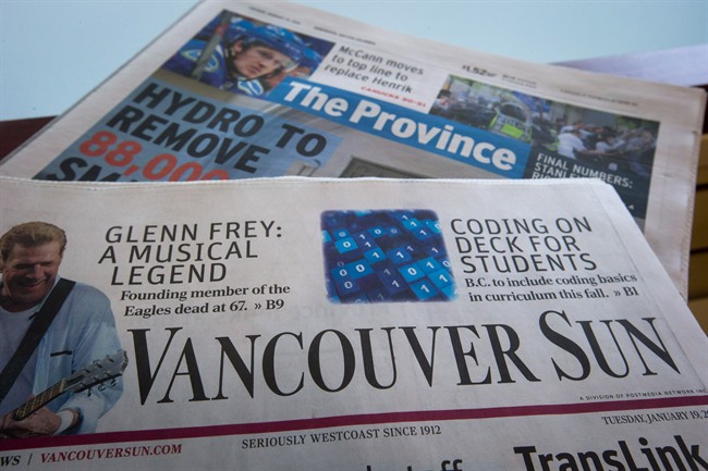 Copies of Postmedia-owned newspapers the Vancouver Sun and Province are displayed at a store in Burnaby, B.C., on Tuesday January 19, 2016. 