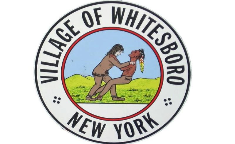 Whitesboro's website says the emblem dates to the early 1900s and
depicts a friendly wrestling match between village founder Hugh
White and an Oneida Indian.