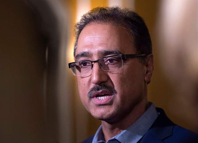 Federal Infrastructure Minister Amarjeet Sohi talks with reporters at a cabinet retreat at the Algonquin Resort in St. Andrews, N.B. on Sunday, Jan. 17, 2016. 