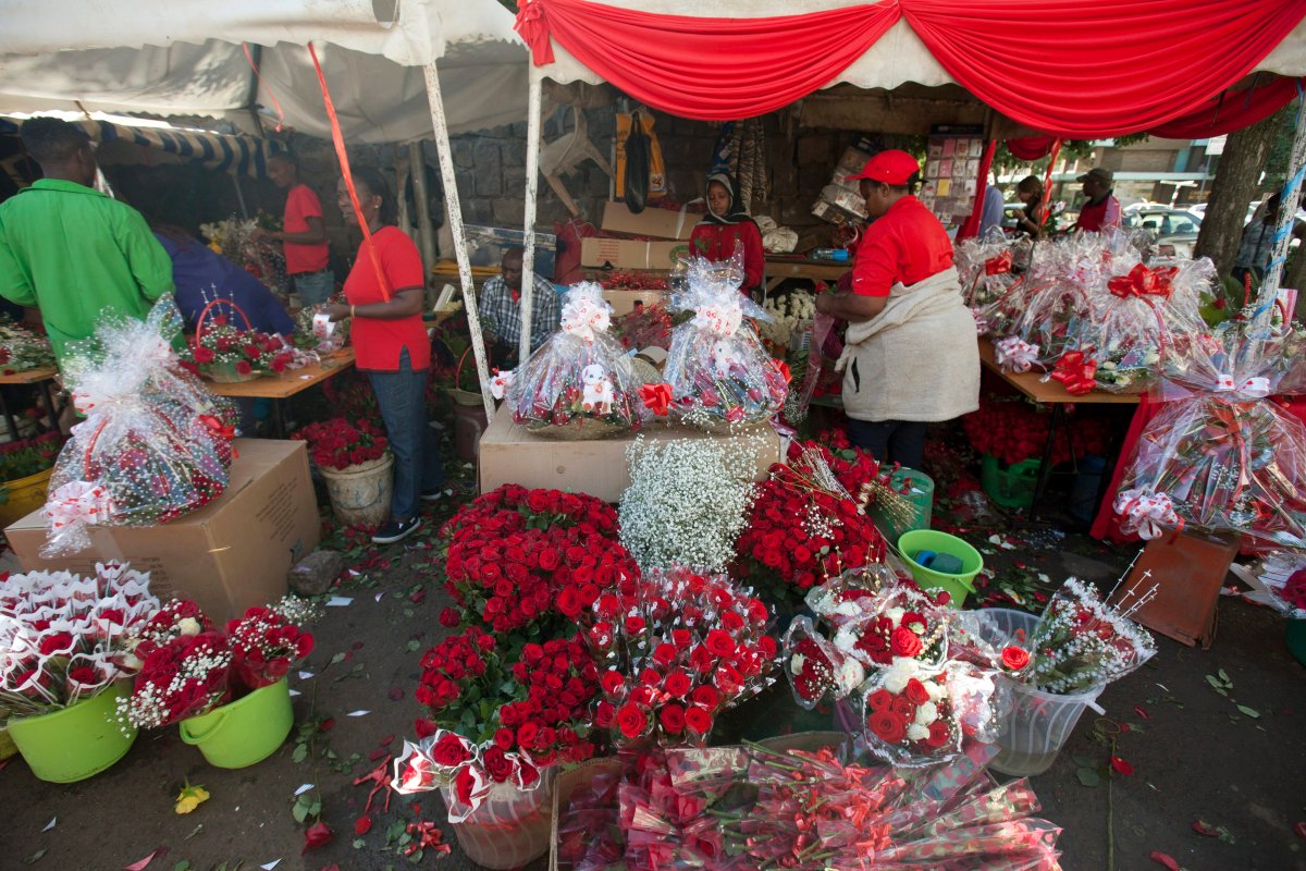 Flower vendors arrange roses for Valentine's Day at a flower market in Nairobi, Kenya, Sunday, Feb. 14, 2016. 