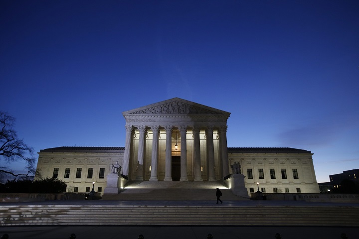 The front of the U.S. Supreme Court is seen early Friday, Feb. 19, 2016 in Washington.  Republican opposition to letting President Barack Obama replace Antonin Scalia quickly sparked a constitutional clash over the presidents right to fill Supreme Court vacancies.