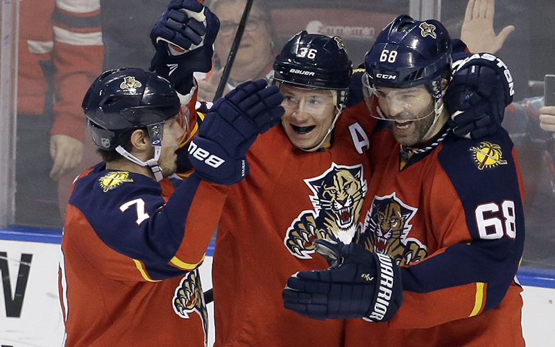 Florida Panthers right wing Jaromir Jagr celebrates with teammates Jussi Jokinen and Dmitry Kulikov after scoring against the Winnipeg Jets during the second period of an NHL hockey game, Saturday, Feb. 20, 2016, in Sunrise, Fla. 