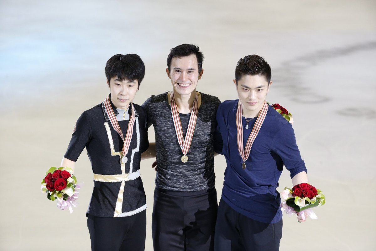 Medal winners, Patrick Chan of Canada with gold, center, Jin Boyang of China with silver, left, and Yan Han of China with bronze pose together after completing the Men's Free Skating program at the Taiwan ISU Four Continents Figure Skating Championships in Taipei, Taiwan, Sunday, Feb. 21, 2016. 