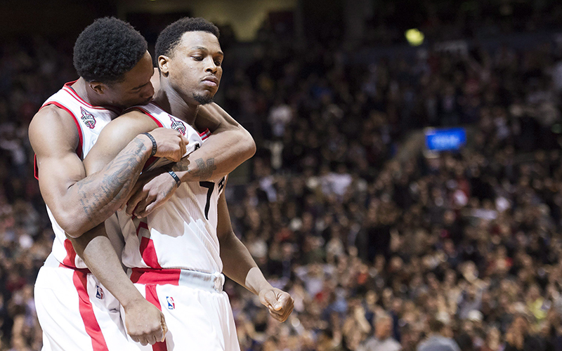 Toronto Raptors guard Kyle Lowry is hugged by Raptors guard DeMar DeRozan after Lowry made the game winning basket to defeat the Cleveland Cavaliers during second half NBA basketball action in Toronto on Friday, February 26, 2016. 