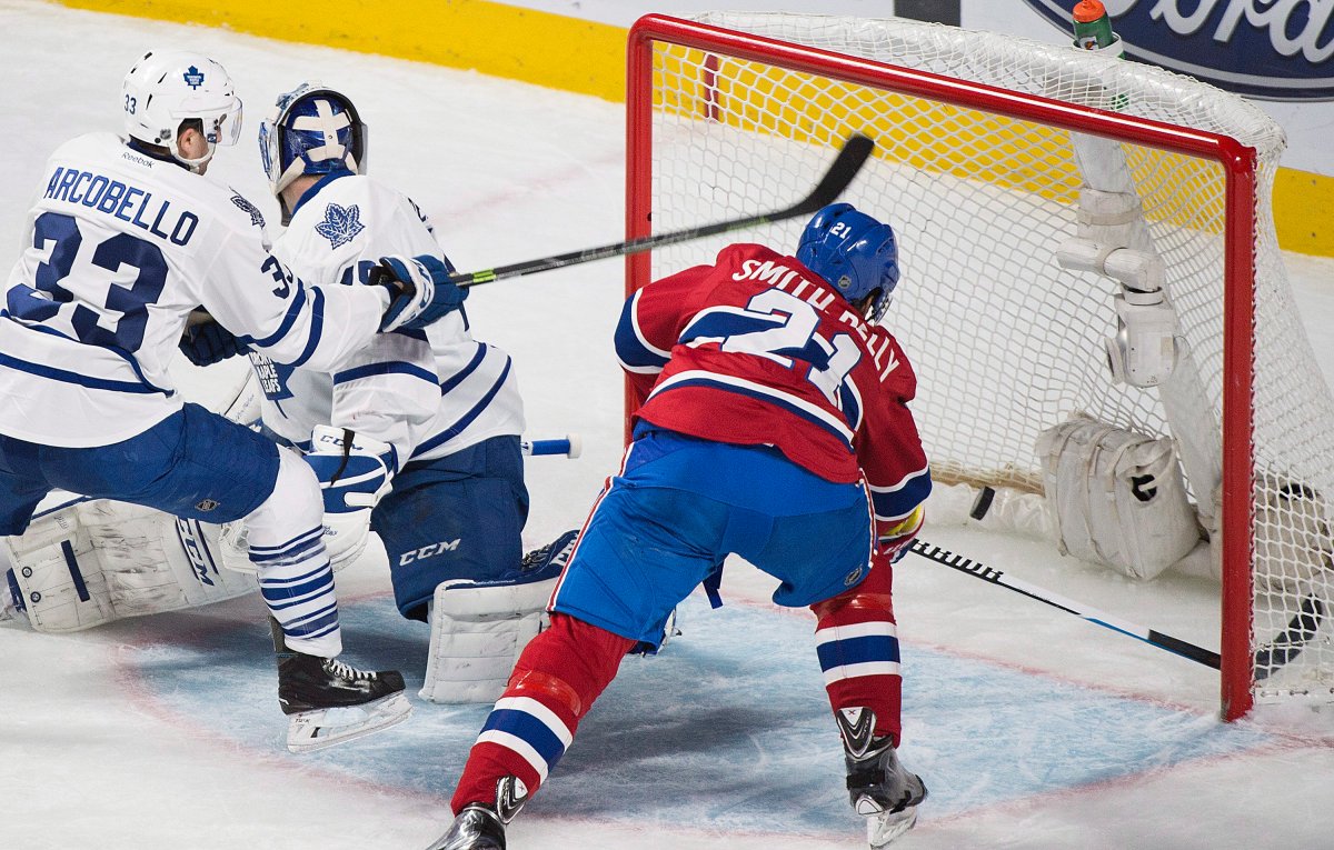 Montreal Canadiens' Devante Smith-Pelly scores on Toronto Maple Leafs goaltender Jonathan Bernier as Leafs' Mark Arcobello defends during second period NHL hockey action in Montreal, Saturday, February 27, 2016.
