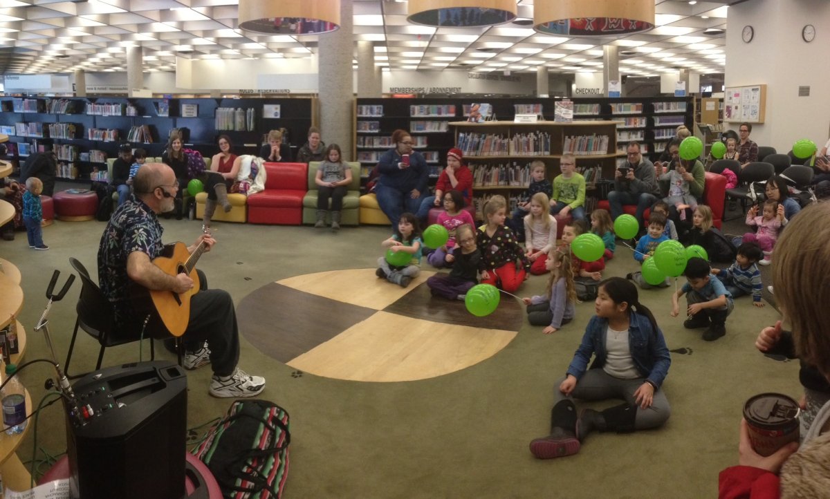 Jake Chenier performs at Millennium Library.