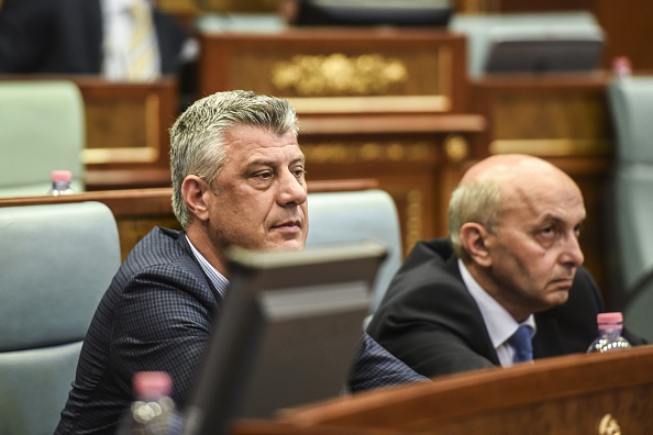 Kosovo's Prime Minister Isa Mustafa (R) and Kosovo's Foreign Minister Hashim Thaci (L) attend a parliamentary session in Pristina on August 3, 2015. Kosovo lawmakers are set to vote today for constitutional amendments that will pave the way for the establishment of a special EU-backed court to address war crimes allegedly committed by ethnic Albanian guerrillas during the 1998-1999 war. 