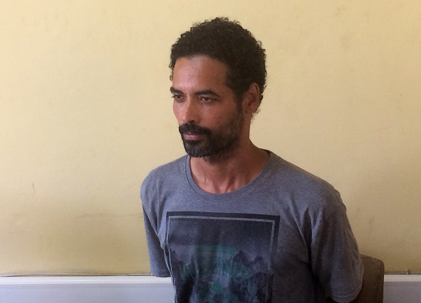 Arthur Simpson-Kent, boyfriend of former British soap actress Sian Blake, looks on in Accra on January 10, 2016, after he was arrested on January 9 in Ghana over the murder of the actress and their two young sons.
Arthur Simpson-Kent now faces extradition to the United Kingdom, police said today. Investigators tracked Arthur Simpson-Kent to undergrowth near the seaside town of Butre,where he was taken into custody on January 9 in connection with the death of the former EastEnders actress and their two children Zachary, 8, and Amon, 4.