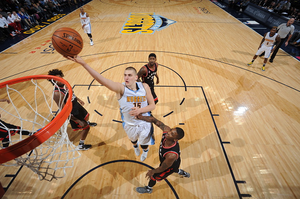 Nikola Jokic #15 of the Denver Nuggets goes to the basket against the Toronto Raptors on February 1, 2016 at the Pepsi Center in Denver, Colorado. (Photo by Garrett Ellwood/NBAE via Getty Images).