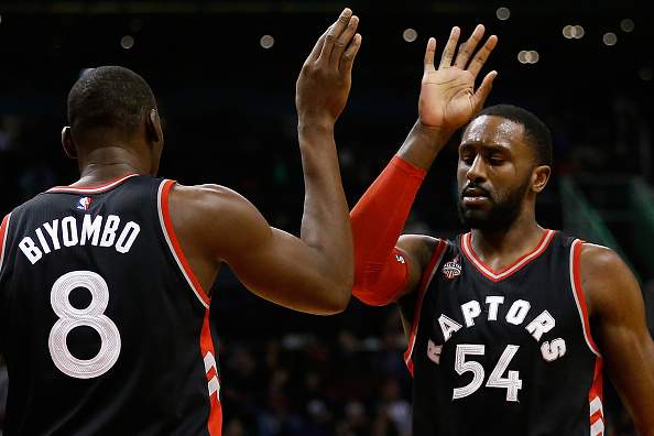 Patrick Patterson #54 of the Toronto Raptors high fives Bismack Biyombo #8 during the first half of the NBA game against the Phoenix Suns at Talking Stick Resort Arena on February 2, 2016 in Phoenix, Arizona.  (Photo by Christian Petersen/Getty Images).