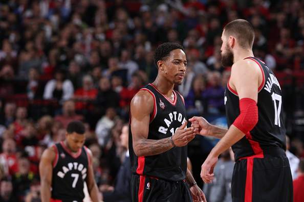 DeMar DeRozan #10 of the Toronto Raptors celebrates a play with Jonas Valanciunas #17 of the Toronto Raptors against the Portland Trail Blazers on February 4, 2016 at the Moda Center in Portland, Oregon.  (Photo by Sam Forencich/NBAE via Getty Images).