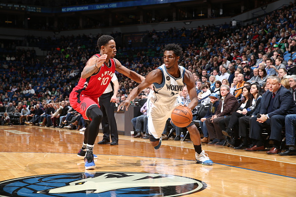 Andrew Wiggins #22 of the Minnesota Timberwolves drives to the basket against DeMar DeRozan #10 of the Toronto Raptors on February 10, 2016 at Target Center in Minneapolis, Minnesota.  (Photo by David Sherman/NBAE via Getty Images).