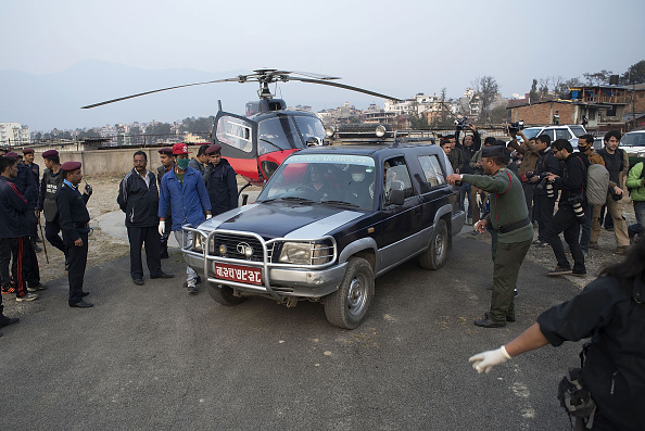Hospital employees carry the bodies of Nepalese plane crash victims by 4WD to the Teaching Hospital Morgue after rescue team brought them by helicopters from Pokhara on February 25, 2016 in Kathmandu, Nepal. 