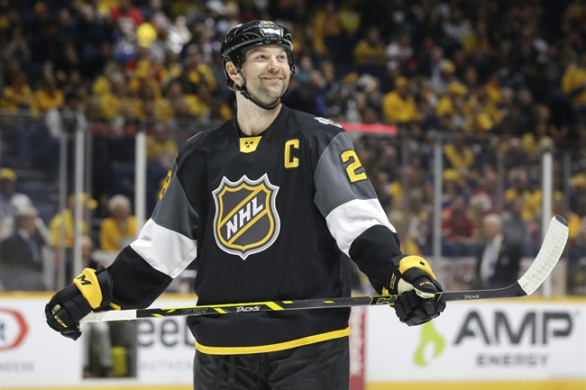 Pacific Division forward John Scott looks into the stands during the NHL hockey All-Star championship game against the Atlantic Division Sunday, Jan. 31, 2016, in Nashville, Tenn. 