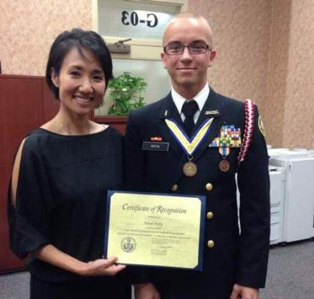 23-year-old Ukrainian national Artur Samarin is accused of pretending to be a high school student. In this picture, Samarin poses with Pennsylvania State Rep. Patty Kim after he was inducted into the National Honor Society.
