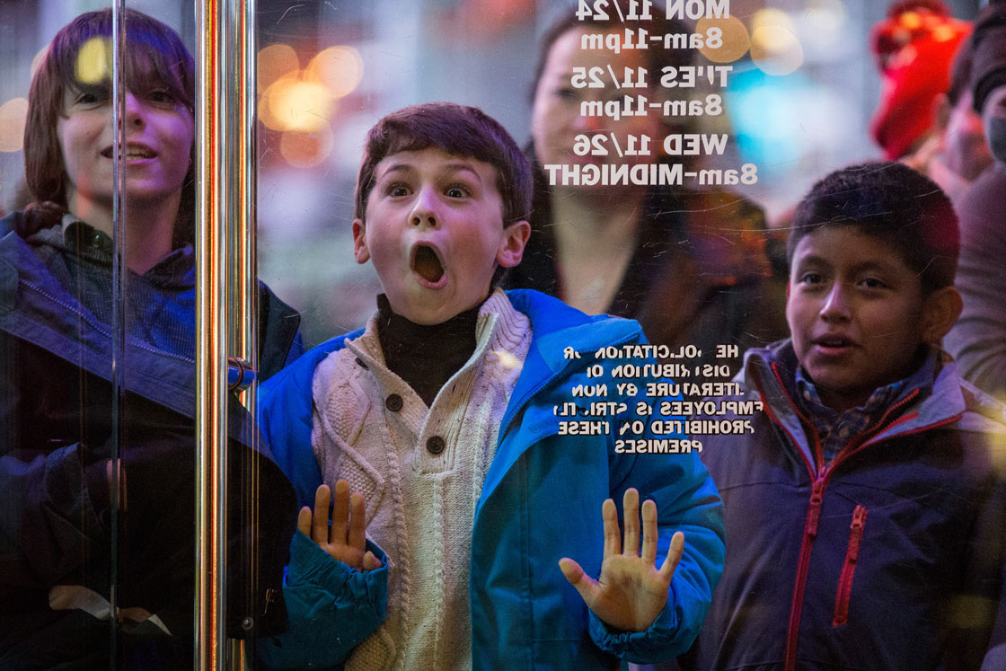 A boy waits to enter the Toys R Us on Black Friday last November.
