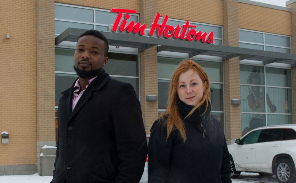 Mactar Mbaye and his interviewee outside the Tim Hortons in Laval, Thursday, February 25, 2016.