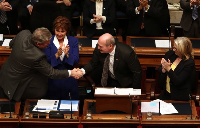 B.C. Finance Minister Michael de Jong is met with applause after delivering the budget on Tuesday, Feb. 16, 2016.