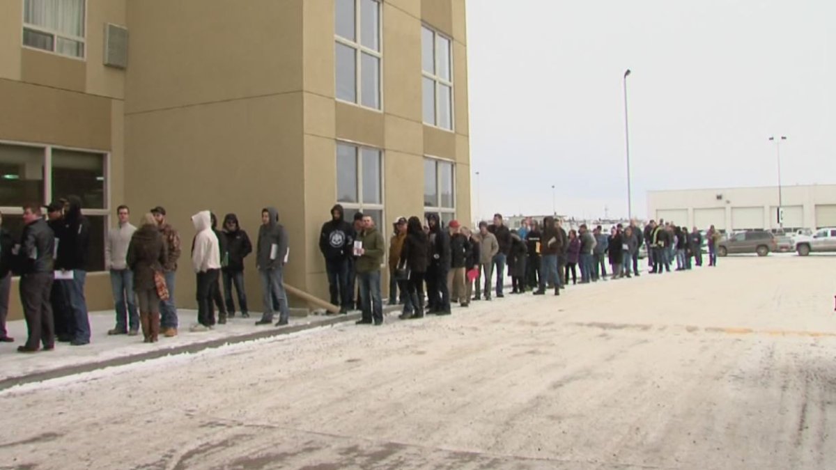 People in Fort St. John line up for a Site C job fair on February 19, 2016. 