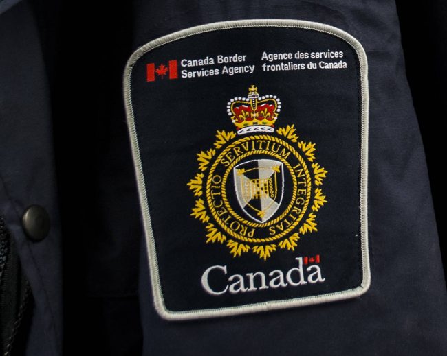 Canada Border Services Agency officers found three loaded guns, magazines and ammunition in garbage bags behind the glove box of Michelle Downey's vehicle in April, 2013.