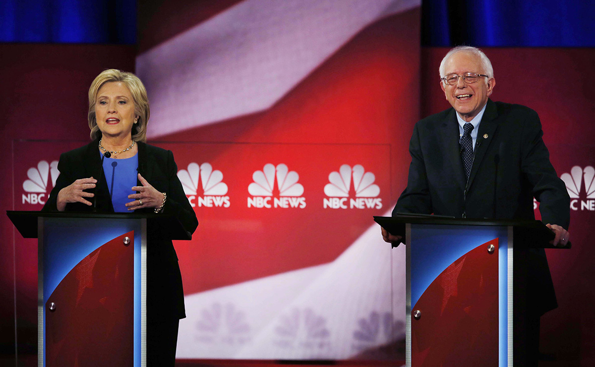 Democratic presidential candidate, Hillary Clinton gestures during the NBC, YouTube Democratic presidential debate at the Gaillard Center, Sunday, Jan. 17, 2016, in Charleston, S.C. To the right is Democratic presidential candidate, Sen. Bernie Sanders, I-Vt. 