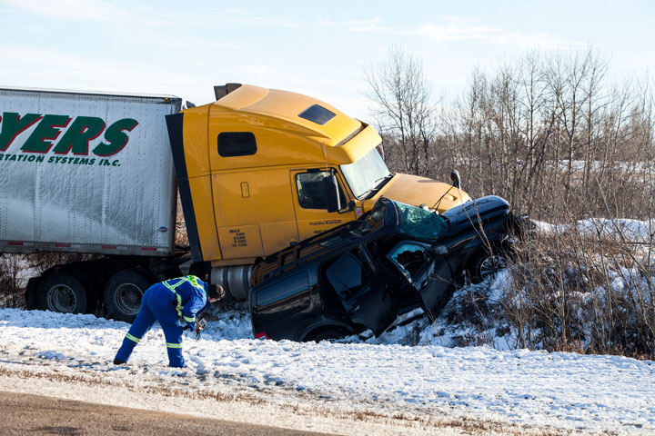 One person is dead and the driver of a semi has been charged following a crash on Highway 16 in North Battleford, Sask.